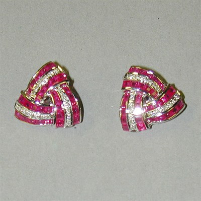 Lot 348 - Pair of Diamond and Ruby Earclips 18 kt. white...