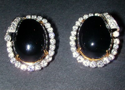 Lot 378 - Pair of Diamond and Onyx Earclips 18 kt....