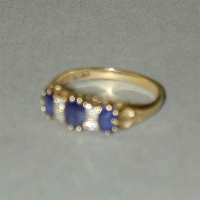 Lot 294 - Gold, Diamond and Sapphire Ring 18 kt. yellow...