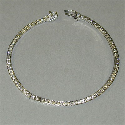 Lot 287 - Gold and Diamond Line Bracelet 14 kt. white...