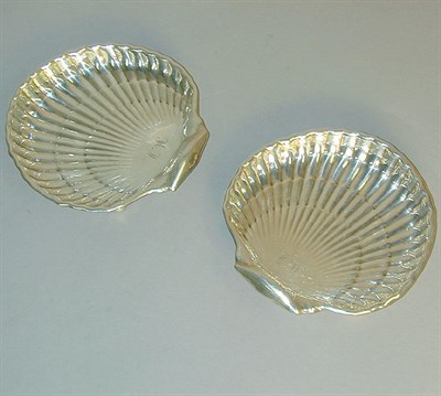 Lot 745 - Two Cartier Sterling Silver Shell-Form Dishes...