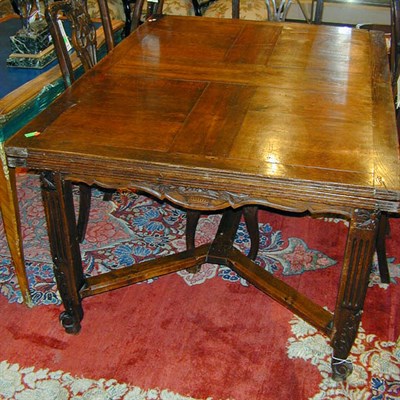 Lot 272 - Rococo Style Oak Draw-Leaf Table The foliate...