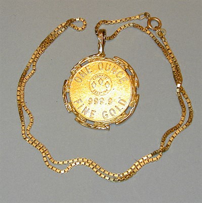 Lot 211 - Gold Pendant and Chain The 14 kt. yellow gold...