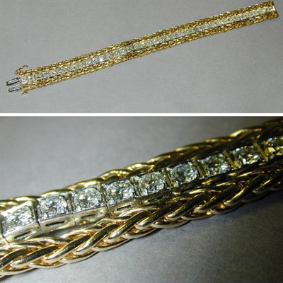 Lot 422 - Diamond Straight Line Bracelet The flexible...