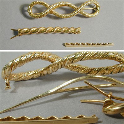 Lot 35 - Three Assorted Hair Accessories 14 kt. yellow...
