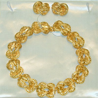 Lot 331 - Gold Necklace and Pair of Earclips 22 kt....