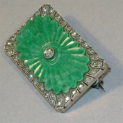 Lot 286 - Carved Jade and Diamond Pin The 14 kt. white...