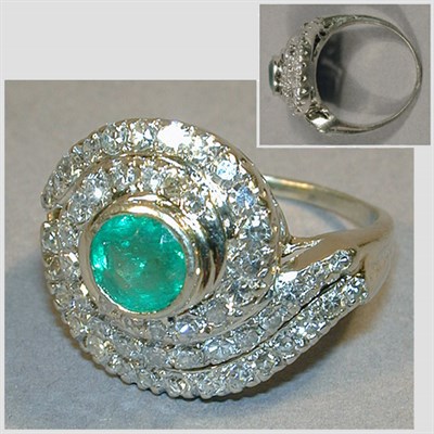 Lot 250 - Emerald and Diamond Cluster Ring 14 kt. white...