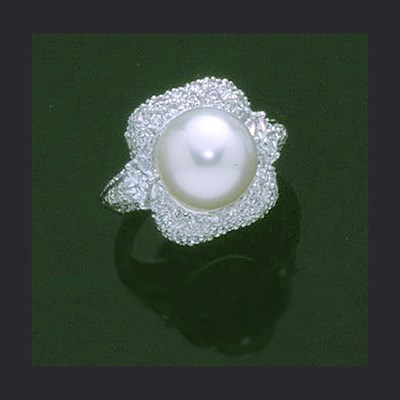 Lot 280 - Cultured Pearl and Diamond Ring The 18 kt....