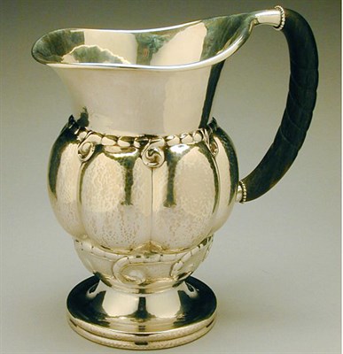 Lot 313 - Georg Jensen Sterling Silver Pitcher Of lobed...
