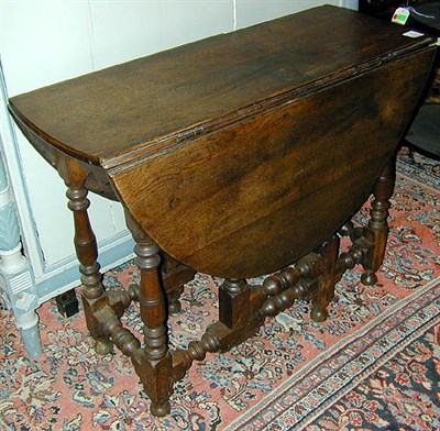 Lot 154 - Provincial George III Style Elm Gate-Leg Table