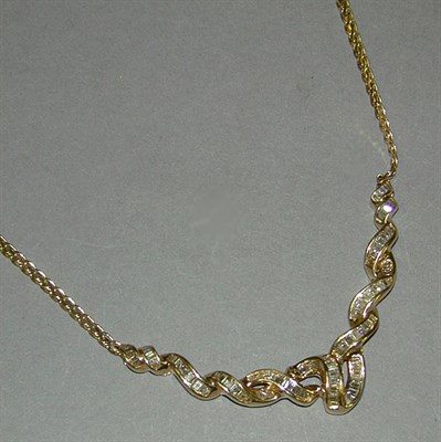 Lot 368 - Diamond Necklace The 14 kt. yellow gold S-link...