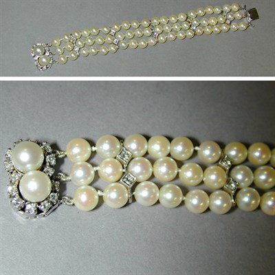 Lot 311 - Cultured Pearl Bracelet Designed as three...