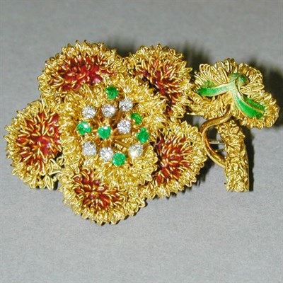 Lot 118 - Diamond and Emerald Flower Brooch 18 kt....