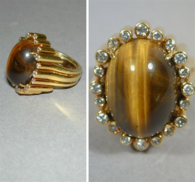 Lot 169 - Tiger's-Eye and Diamond Ring The 18 kt. yellow...