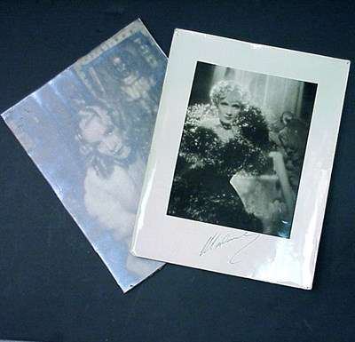 Lot 105 - DIETRICH, MARLENE Two photographs, one...