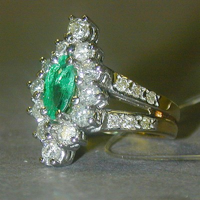 Lot 309 - Emerald and Diamond Ring The 14 kt. yellow...