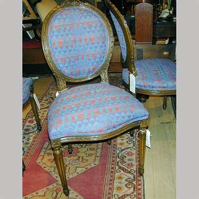 Lot 110 - Set of Four Louis XVI Style Upholstered Walnut...