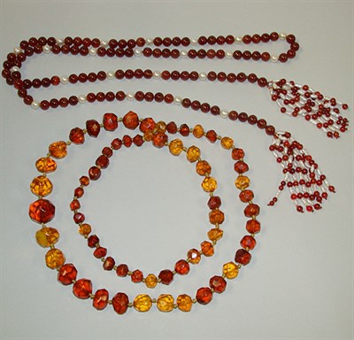 Lot 311 - Two Bead Necklaces One a long single strand of...