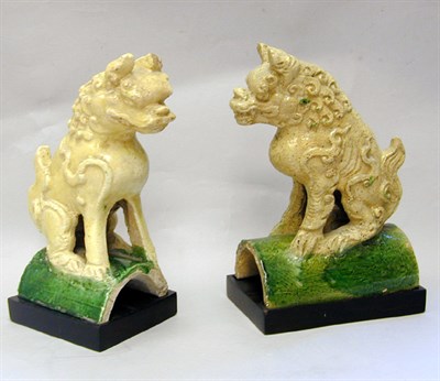 Lot 142 - Two Chinese Straw and Green Glazed Tilework Fu...