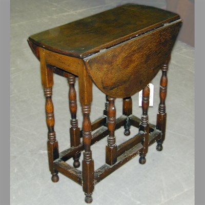 Lot 145 - Provincial Georgian Style Oak Gate-Leg Table
