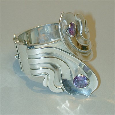 Lot 229 - Large Silver Cuff Bracelet The rigid cuff...
