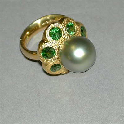 Lot 414 - Gray South Seas Cultured Pearl and Garnet Ring...