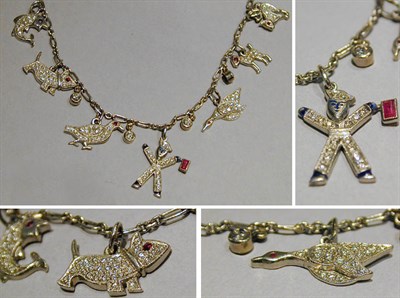 Lot 411 - Platinum and Diamond Charm Necklace The...