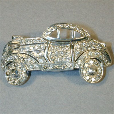 Lot 269 - Diamond Car Pin 14 kt. white gold, set...