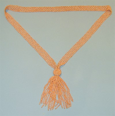 Lot 225 - Coral Sautoir The 1 inch wide woven bead...