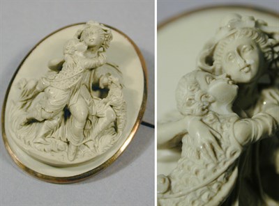Lot 70 - Carved Lava Cameo Pin The yellow gold frame...
