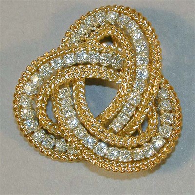 Lot 323 - Gold and Diamond Scroll Pin 18 kt. yellow gold,...