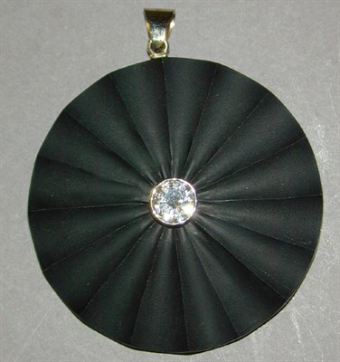 Lot 115 - Black Onyx and Diamond Pendant The fluted...