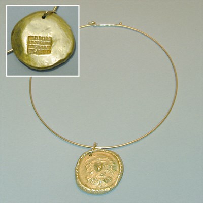 Lot 213 - Gold Torque and Pendant 14 and 18 kt. yellow...