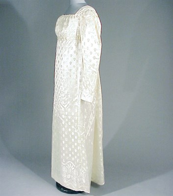 Lot 69 - Ivory Figured Silk Empire Dress American,...