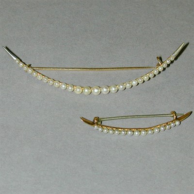 Lot 249 - Two Natural* Pearl Crescent Pins 14 kt. yellow...