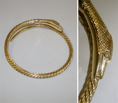 Lot 401 - 18 Kt. Gold Snake Bangle Bracelet A single...
