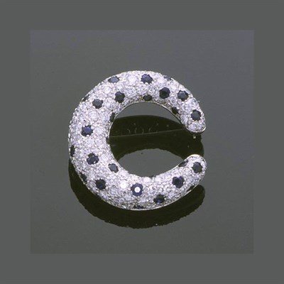 Lot 356 - Sapphire and Diamond Crescent Pin 18 kt. white...