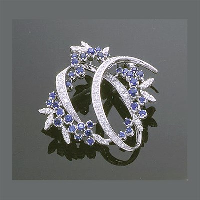 Lot 355 - Diamond and Sapphire Garland Brooch 18 kt....
