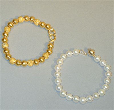 Lot 205 - Two Bead Bracelets Comprising one bracelet...