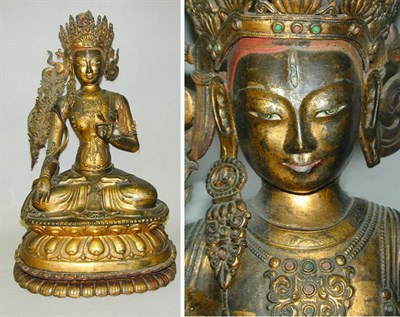 Lot 147 - Tibetan Gilt Copper Repousse Figure of a...