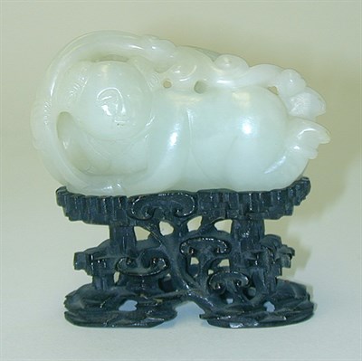 Lot 237 - Chinese Carved White Jade Sleeve Weight Figure...