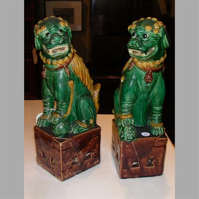Lot 165 - Pair of Chinese Polychrome Decorated Foo Dogs