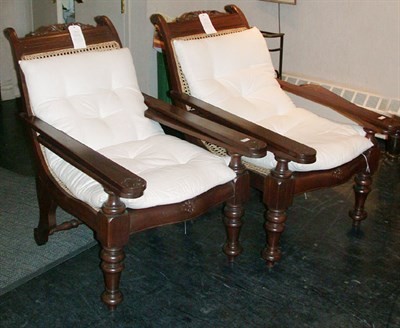 Lot 146 - Pair of Colonial Revival Caned Mahogany Easy...
