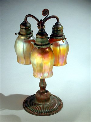 Lot 238 - Tiffany Studios Bronze and Favrile Glass Lamp...