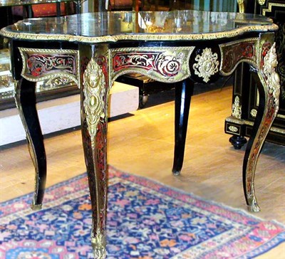 Lot 688 - Boulle Style Center Table The shaped oval top...