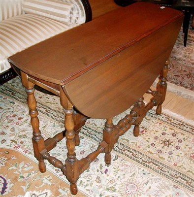 Lot 488 - Provincial Georgian Style Walnut Gate-Leg Table