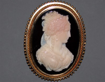 Lot 210 - Hardstone Cameo Pin The 14 kt. yellow gold...