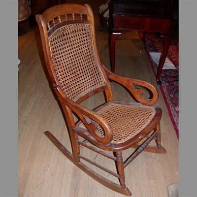 Lot 142 - Victorian Caned Cherry Rocking Chair