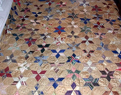 Lot 322 - Pieced Silk Quilt With small star pattern,...